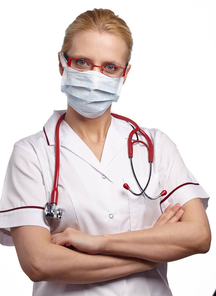 Woman doctor wearing medical anti virus mask. isolated studio portrait. - Fotó, kép