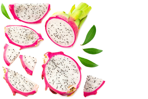 Sliced Ripe Dragon fruit with green leaves isolated on white background. Pitaya or Pitahaya Top view - Фото, зображення