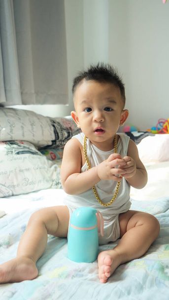 Rich infant baby boy with gold necklace ornament decoration fashion kid - Photo, Image