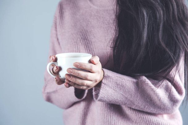 woman hand holding cup of tea or coffee - Fotó, kép