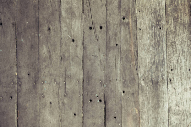Closeup of old brown wooden plank texture background. Wallpaper backdrop. Abstract wood floor and wall structure. Top view angle. Vertical pattern - Foto, immagini