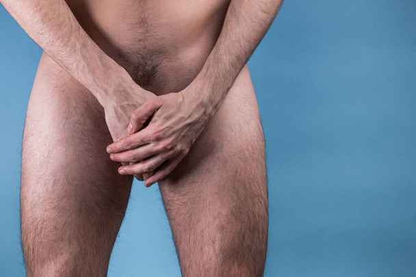 Man Covering His Crotch. concept of male illness. prostate cancer. impotence. - Fotografie, Obrázek