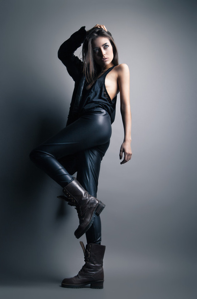 Fashion model wearing leather pants and jacket - Foto, afbeelding