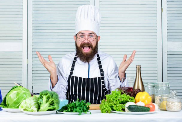 Vegetarian salad with fresh vegetables. Healthy food cooking. Mature hipster with beard. Happy bearded man. chef recipe. Dieting organic food. Cuisine culinary. Vitamin. Tell your opinion - Valokuva, kuva