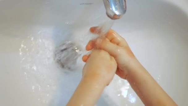 Baby is washing his hands in slow motion. Selective focus - 映像、動画