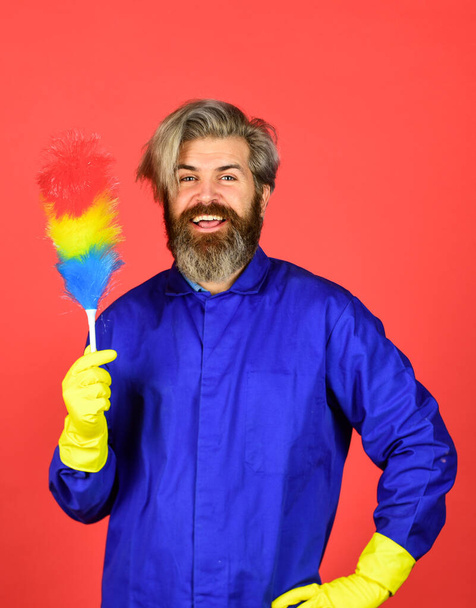 Polypropylene duster. Hipster holding cleaning tool. Cleaning home concept. Small colorful duster broom. Cleaning service. Housekeeping duties. Cleaning apartment. Man use pp duster. Dust allergy - Photo, Image