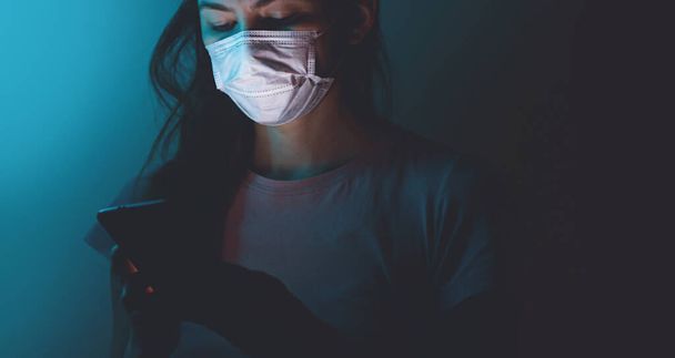 Woman puts on a surgical medical mask. Healthcare concept. New type coronavirus 2019-nCoV - Foto, immagini