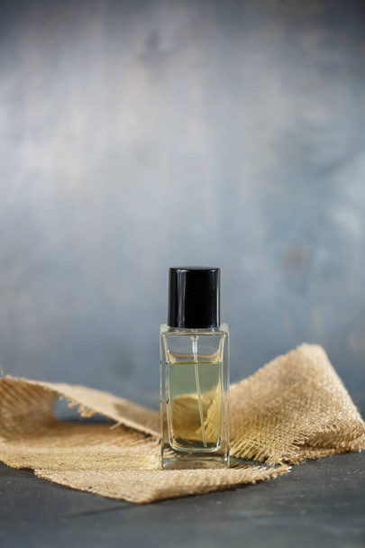 perfume bottle with black cap - Foto, afbeelding