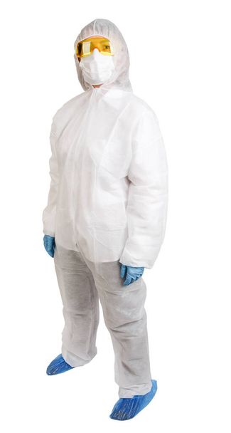 Doctor in disposable anti-epidemic suit wearing a mask and glasses isolated on white background - Photo, Image
