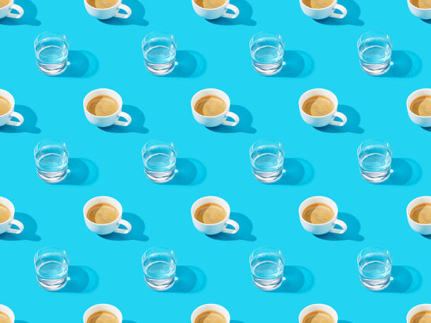 cups of fresh coffee and water on blue, seamless background pattern - Valokuva, kuva