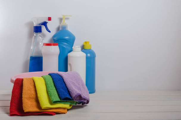 Home cleaning products with colorful napkins on a white background. Spring cleaning, the prevention of viral diseases. Cleaning in the house, in the apartment. - Valokuva, kuva
