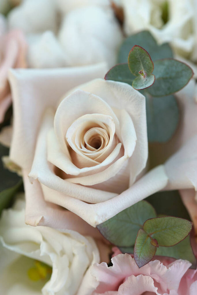 close up of amazing bright bouquet of tender pastel roses and other flowers - Foto, Imagen