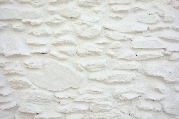 Texture of a wall made with white painted stones in La Alpujarra, Granada, Spain - Photo, Image