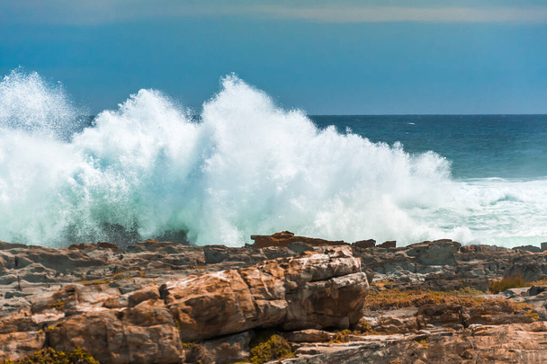 An enormous wave crashing against the rocks at Storms River Mouth, Tsitsikamma National Park, South Africa - Photo, image
