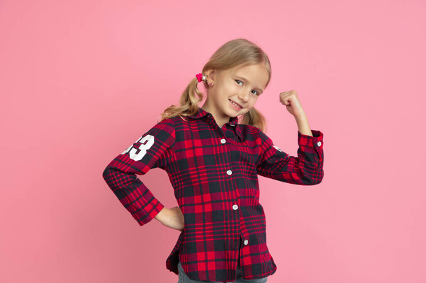Caucasian little girls portrait on pink studio background - Foto, immagini