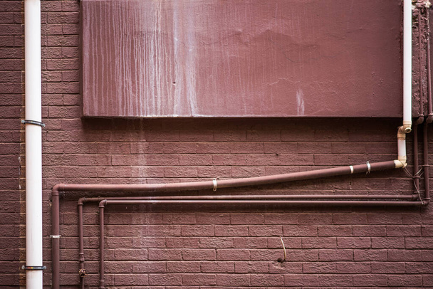 Grungy brown painted wall with pipes	 - Fotoğraf, Görsel