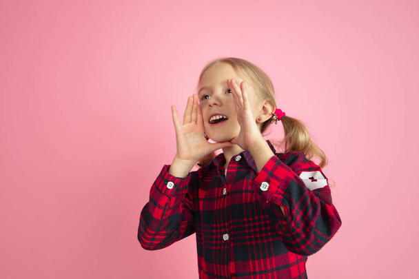 Caucasian little girls portrait on pink studio background - Foto, imagen