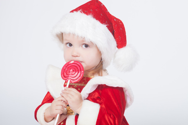 Santa Claus baby girl, studio shot - Foto, Imagen