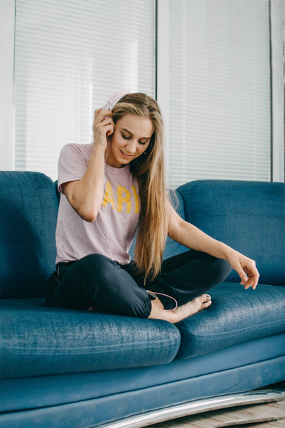 Mood booster playlist, feel-good songs enjoy music, have fun. Cheerful young blogger girl enjoy favourite playlist in headphones, listen audio in music app, feel happiness. - 写真・画像