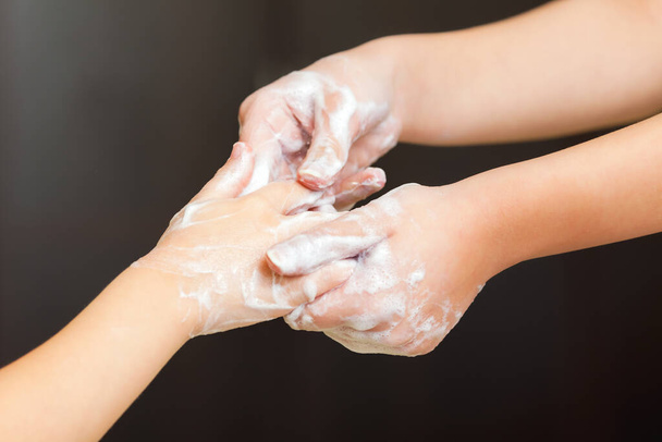 Front view on womans hands with soap foam, personal hygiene concept - Valokuva, kuva