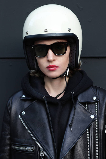 Close-up portrait of biker girl wearing white helmet.  - Φωτογραφία, εικόνα