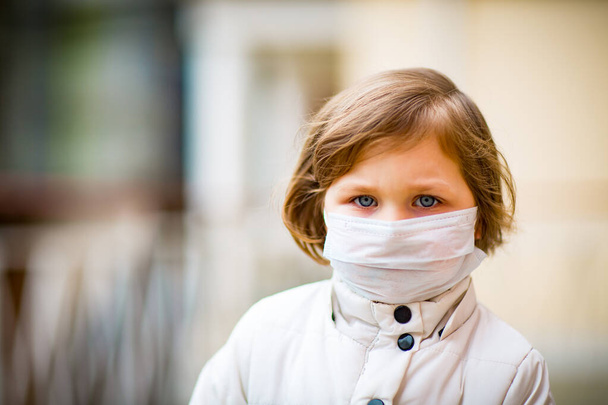 little girl on a walk in a medical mask - Photo, Image