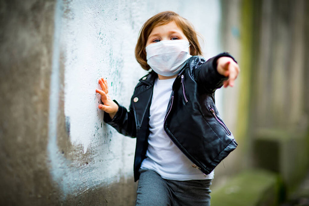 little girl on a walk in a medical mask - Photo, Image