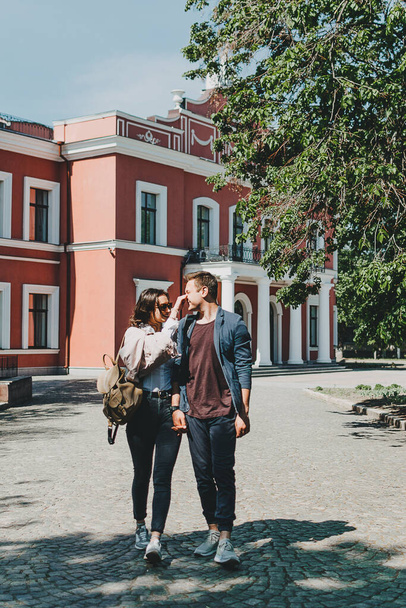 Travel couple, Romantic Destinations, Weekend Getaways, honeymoon for Couples. Happy young travellers woman and man with backpacks walks the streets of the city. - Photo, Image