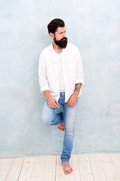 handsome man with beard. sexy model posing. bearded man wear white shirt. male casual fashion. summer collection. male model in white shirt. brutal caucasian hipster with moustache - Fotó, kép