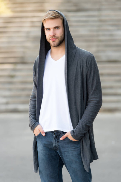 dangerously handsome. man in hood. hooligan wear hoodie. looking like thief in hooded cardigan. Casual style. concept of danger and confidence. Urban fashion look. city modern life. man in hoody. - Foto, imagen