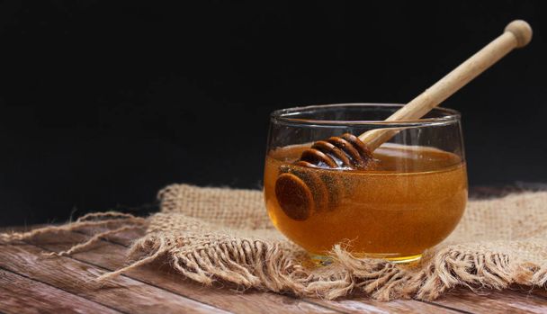Honey is nutritious for health, conceptual with spoon and honeycomb - Φωτογραφία, εικόνα