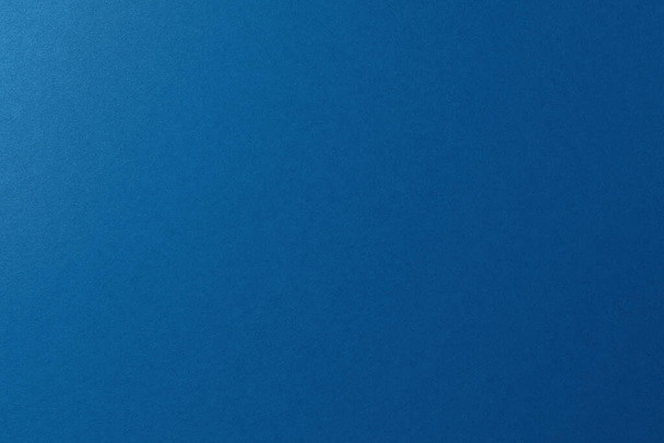 Blue paper background, copy space, horizontal. - Фото, изображение