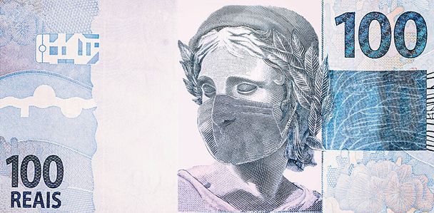 Un billete de cien reales con máscara médica desechable. Concepto de epidemia de coronavirus en Brasil. Impacto de la pandemia del coronavirus en la economía brasileña
 - Foto, Imagen