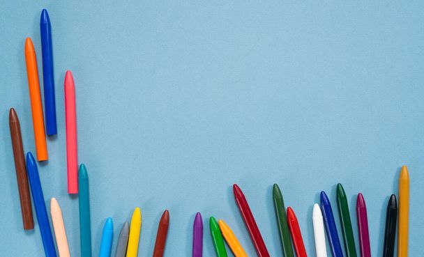 Colorful wax pencils background with copy space. - Фото, изображение