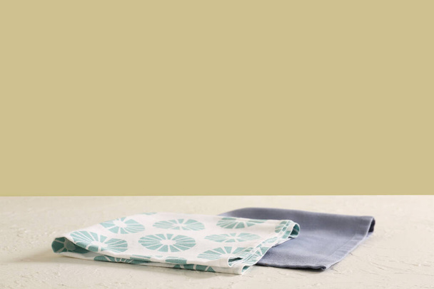 Napkins on table against color background - Photo, Image
