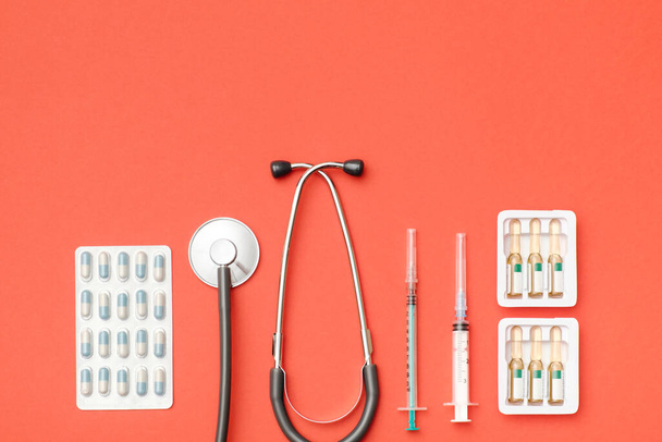 Flat lay of medical tools on colored background. Healthcare insurance concept. Table top view essential doctor's equipment - Photo, Image