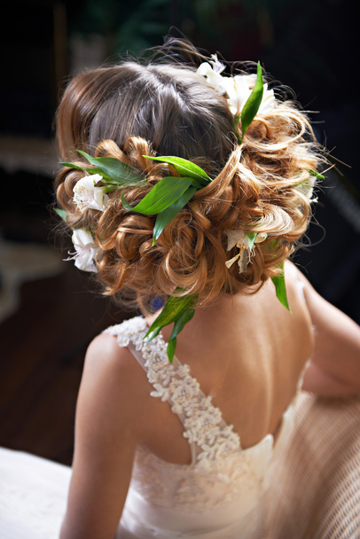 Hairstyle woven with flowers lily - Φωτογραφία, εικόνα