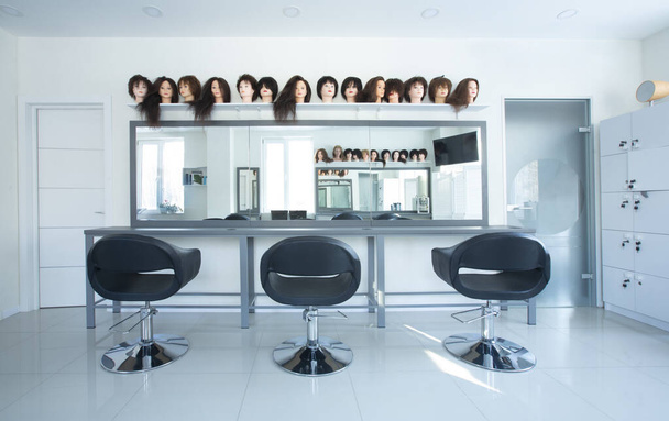 Interior in beauty salon. Chairs for clients and mirror - Photo, Image