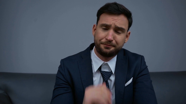 frustrated businessman in suit sitting in hotel  - Felvétel, videó