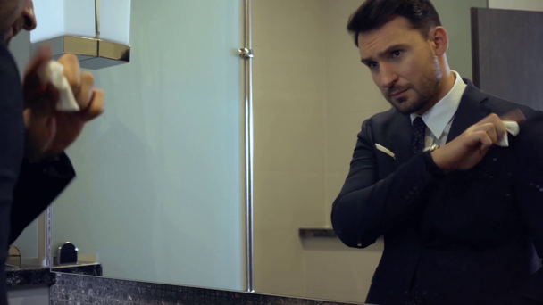 happy businessman looking at mirror in bathroom  - Footage, Video