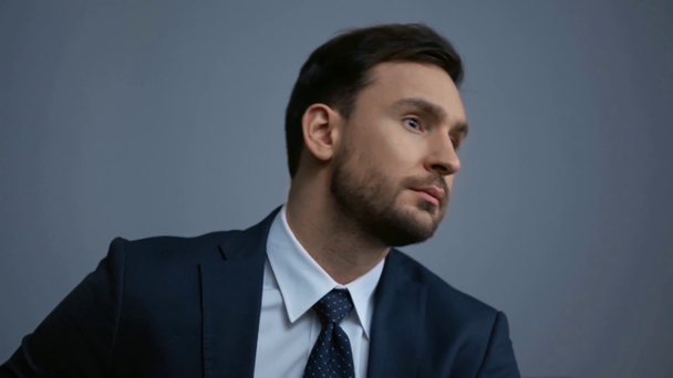 pensive businessman in suit looking away - Footage, Video