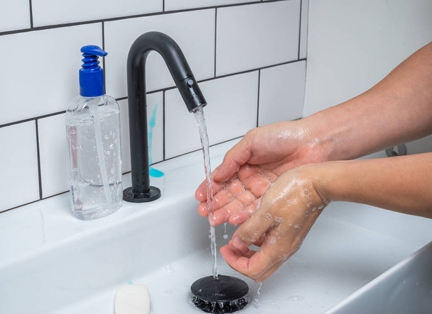 Washing hands with soap to protect against bacteria and viruses - Foto, immagini