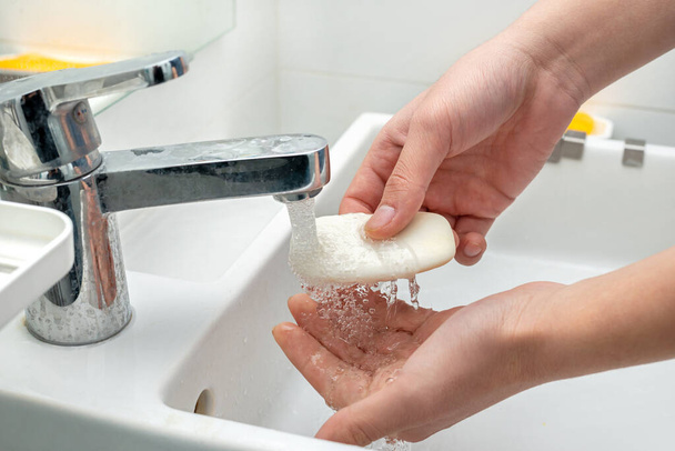 Washing hands with soap to protect against bacteria and viruses - Foto, Imagem