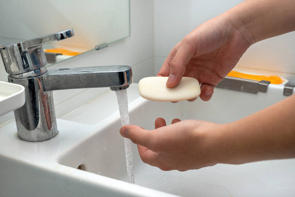 Washing hands with soap to protect against bacteria and viruses - Foto, Imagem