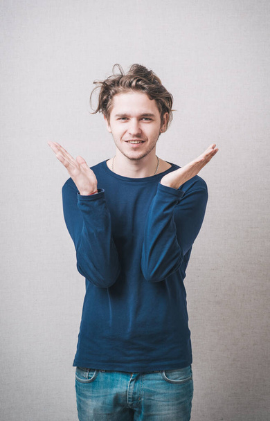 young casual man with a smile on her face and his arms wide open - Photo, image
