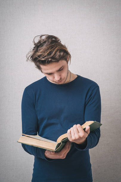 handsome young man reading a book - Photo, image