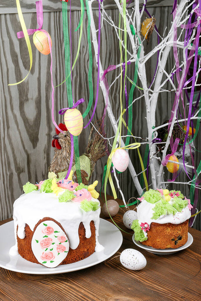 Easter, Easter cake on a dark background with a complex composition, beautiful scenery, dried fruits - Фото, изображение