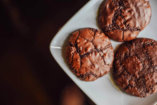 Chocolate brownie cookies in plate  on wood table,Delicious homemade - Photo, Image