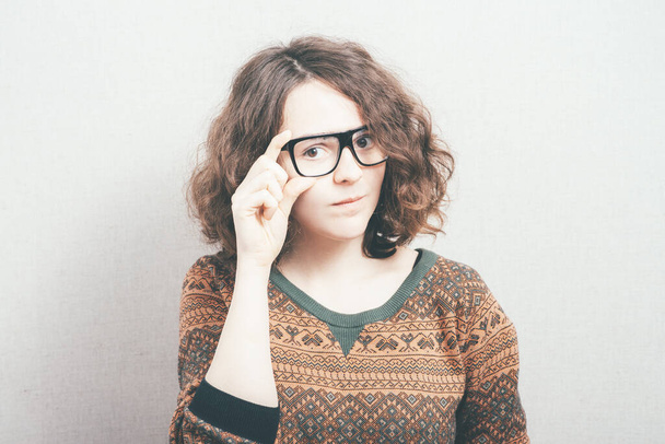 woman in glasses against studio background - Zdjęcie, obraz