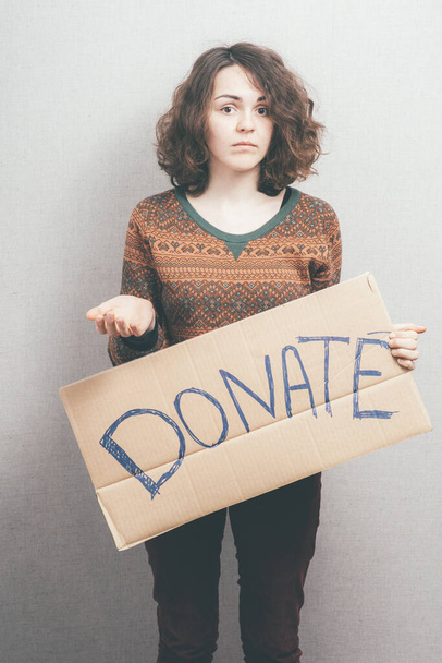 girl holding a sign Donations - Foto, immagini